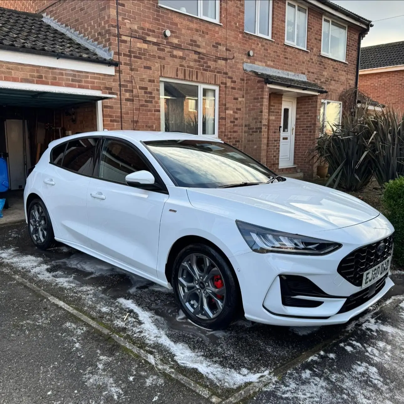 Paintwork being decontaminated during a liquid decontamination wash